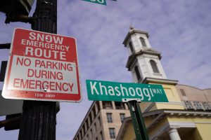 Snow emergency route sign warning no parking during emergencies on a city street
